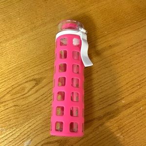 Ello brand glass water bottle with pink rubber sleeve